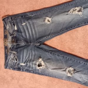 Buckle blue ripped jeans
